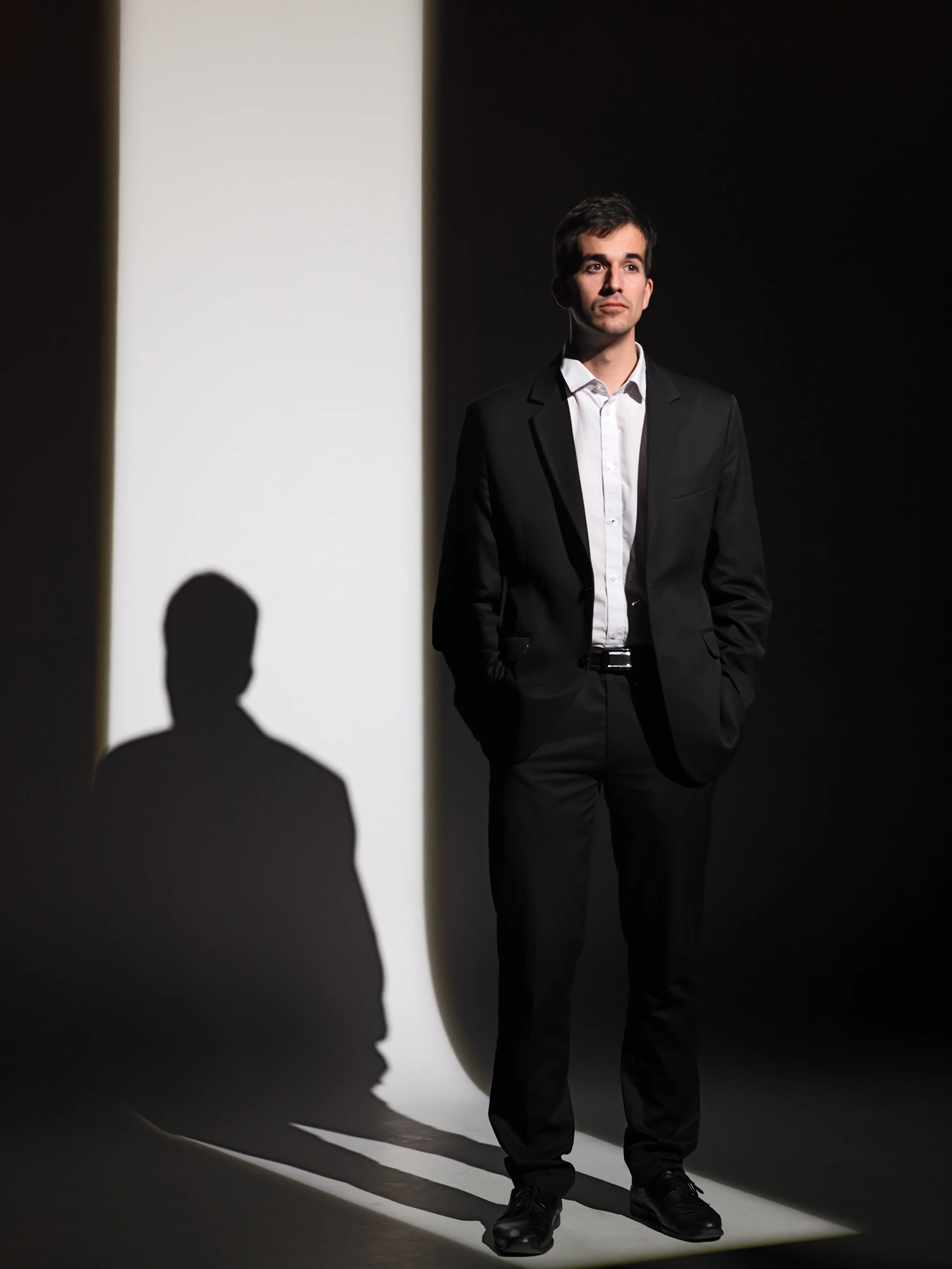 young gentleman standing in suit